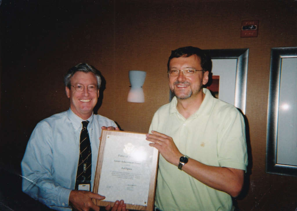 Ted Lipien receiving Career Achievement Award at his retirement party in 2006 from Voice of America Director David Jackson.